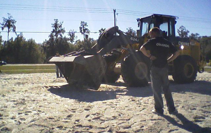 front end loader smoothing sand